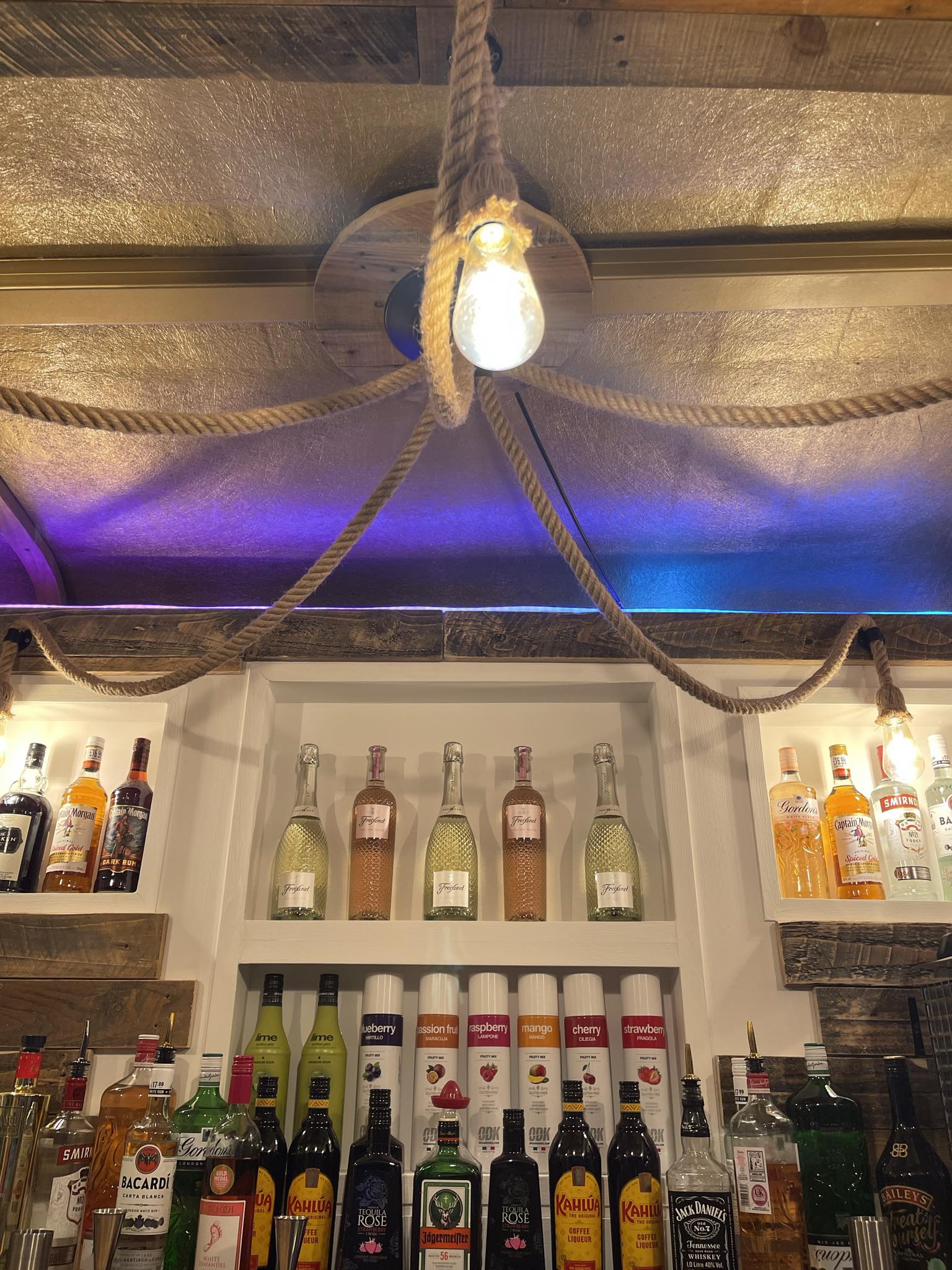 The fully stocked White Oak bar prepared for service