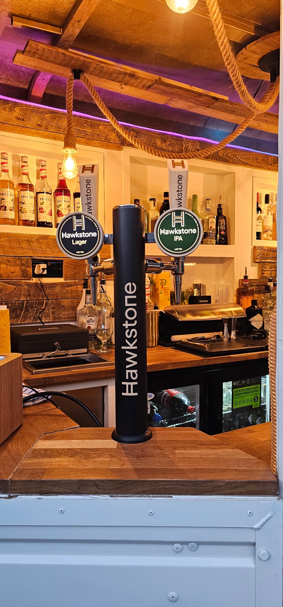 Hawkstone Lager and IPA taps inside The White Oak bar