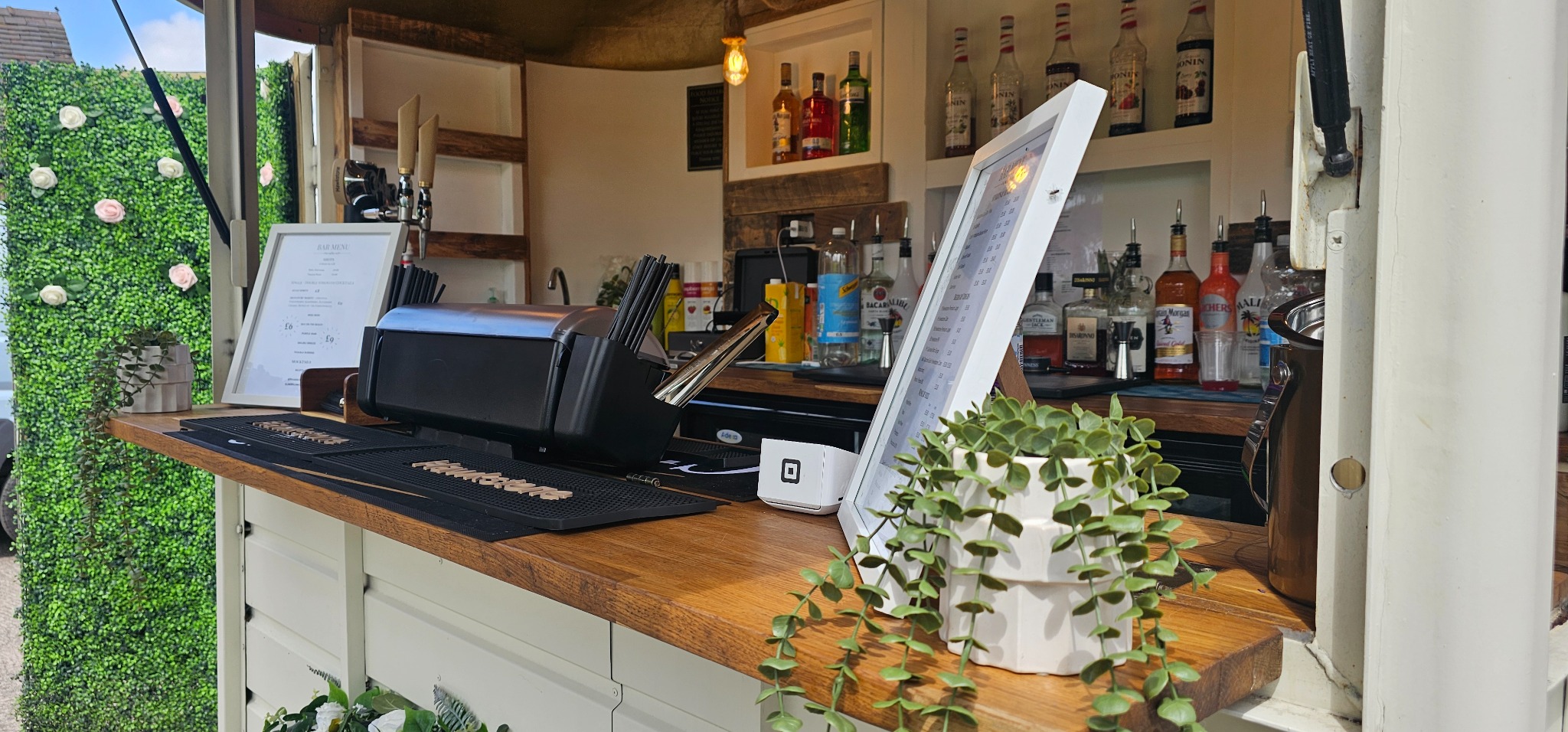 The oak serving counter, menus and bar equipment ready for guests