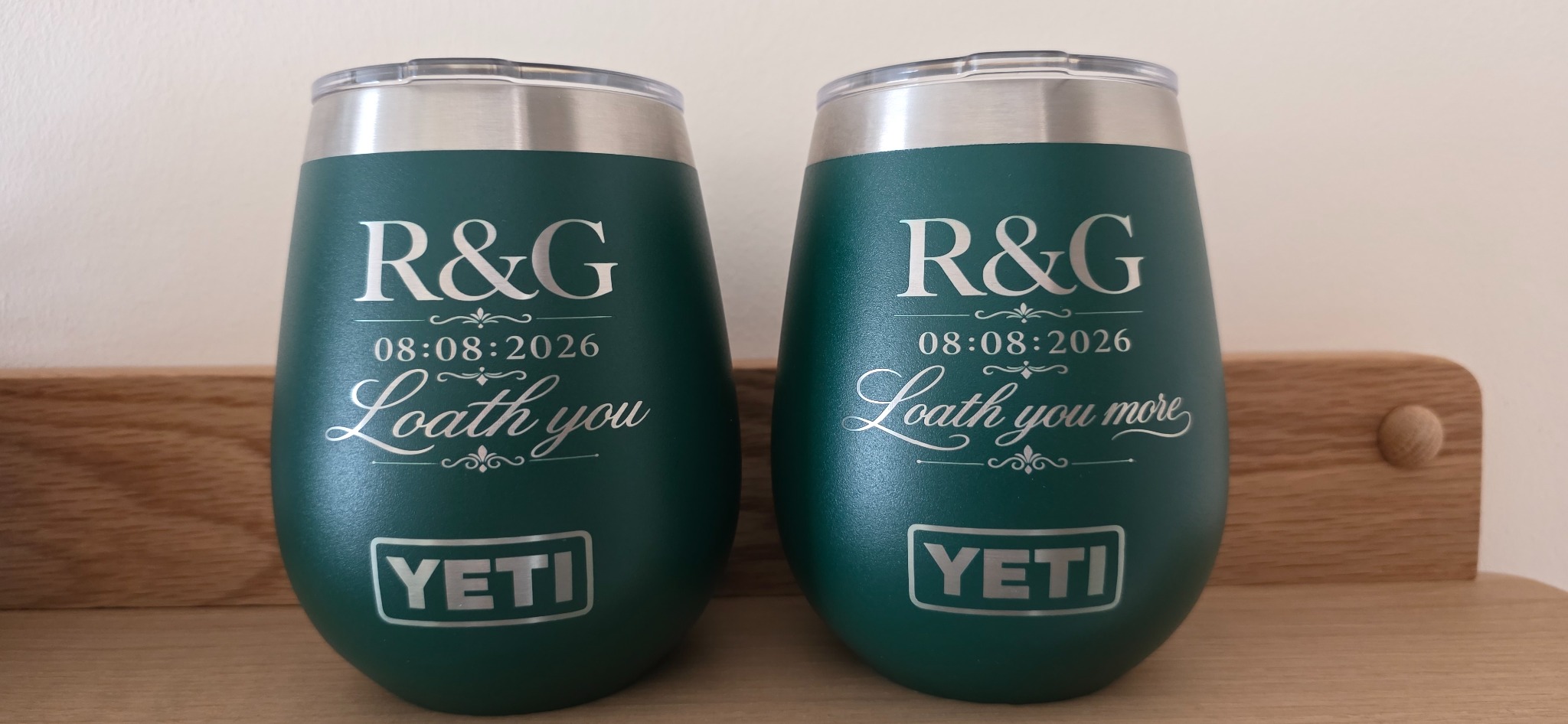 Matching green YETI tumblers engraved with initials, wedding date and a personalised message
